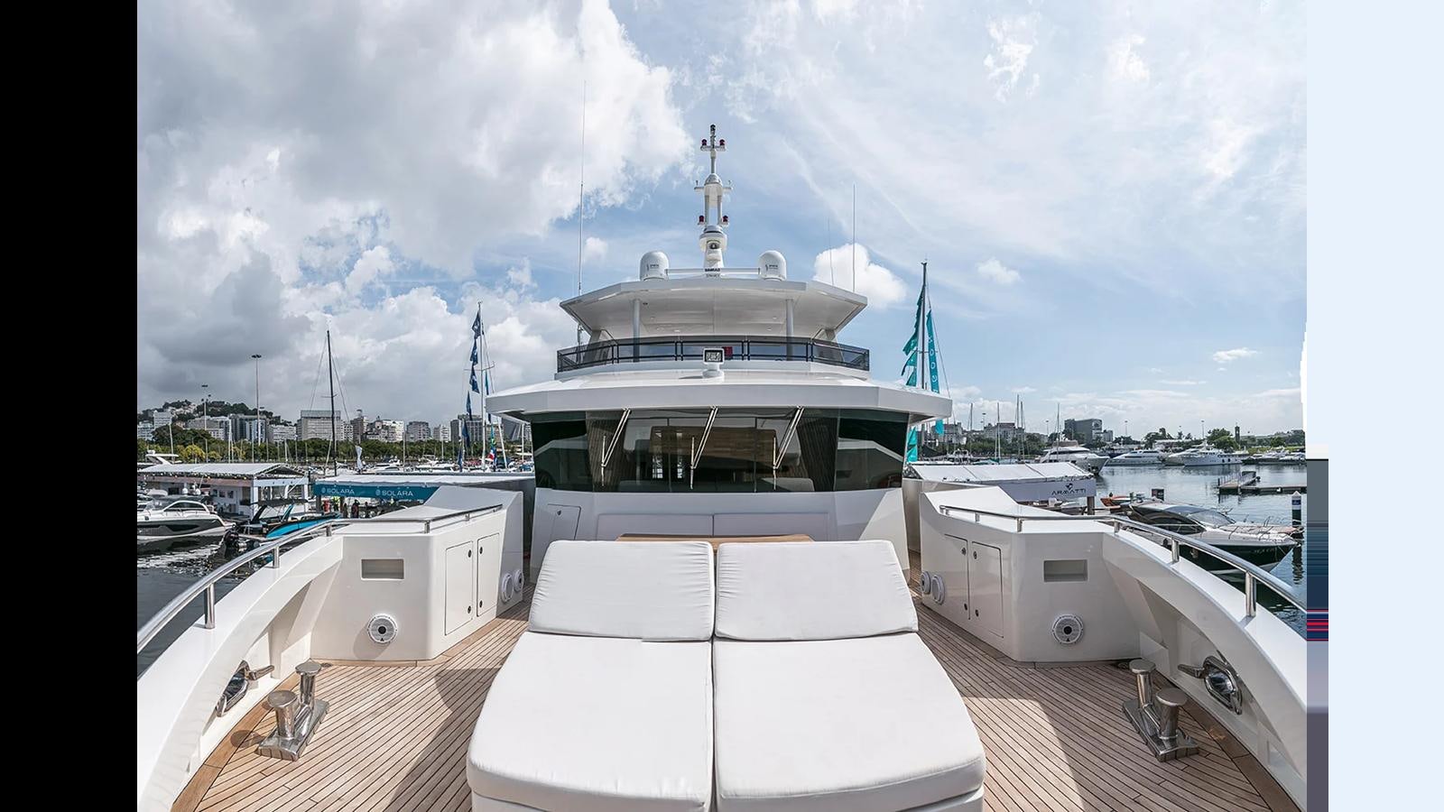 a large white boat in a harbor aboard 2024 INACE EXPLORA 115 Yacht for Sale