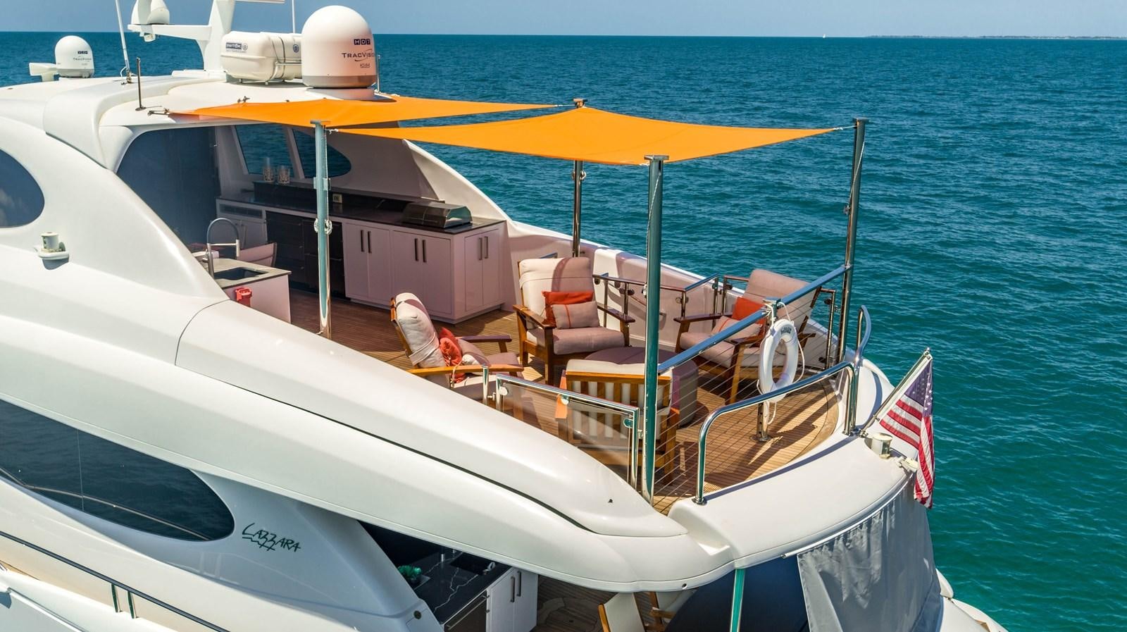 a boat with chairs on the deck aboard VOYAGER Yacht for Sale