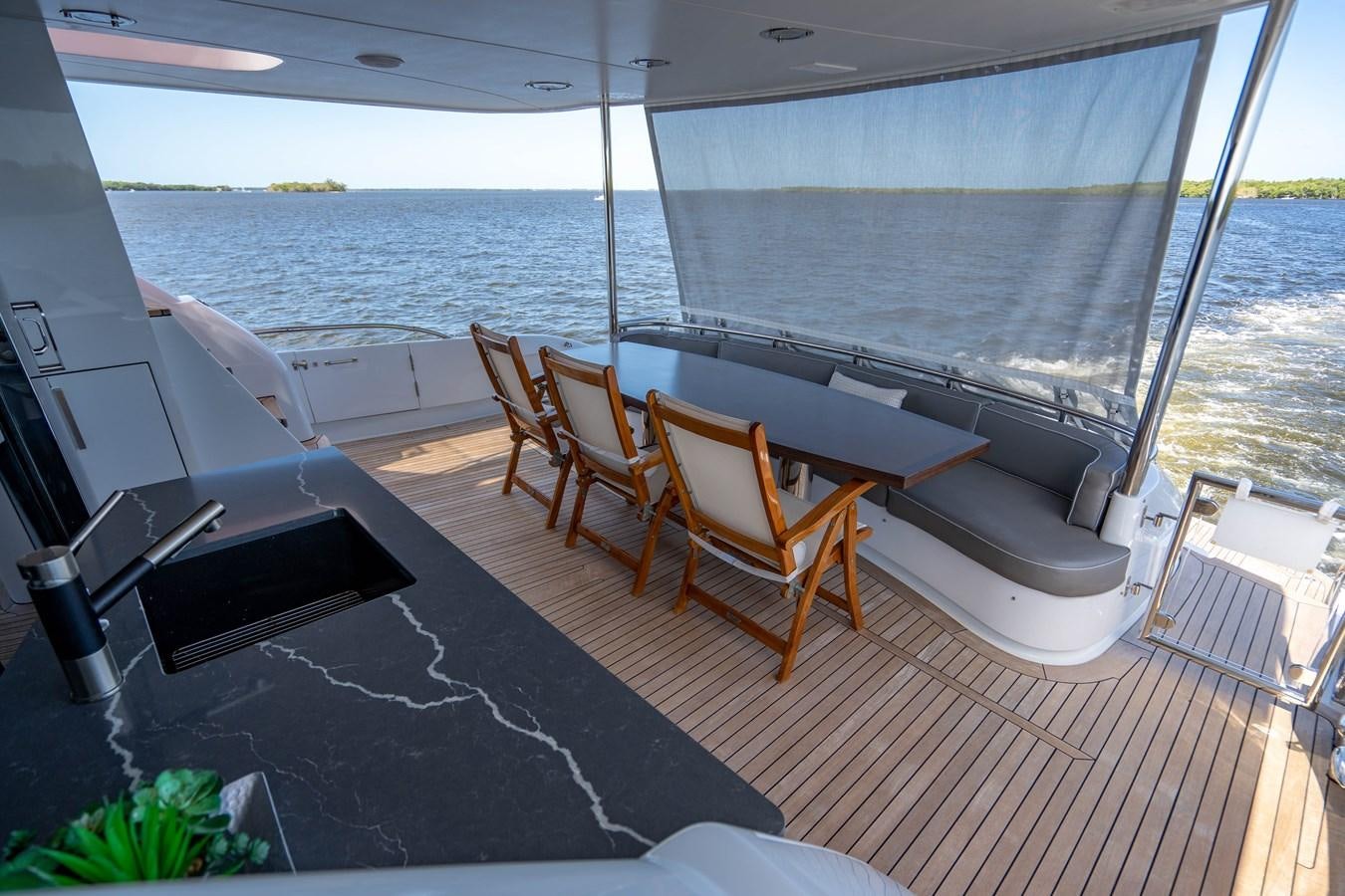 a room with a table and chairs aboard VOYAGER Yacht for Sale