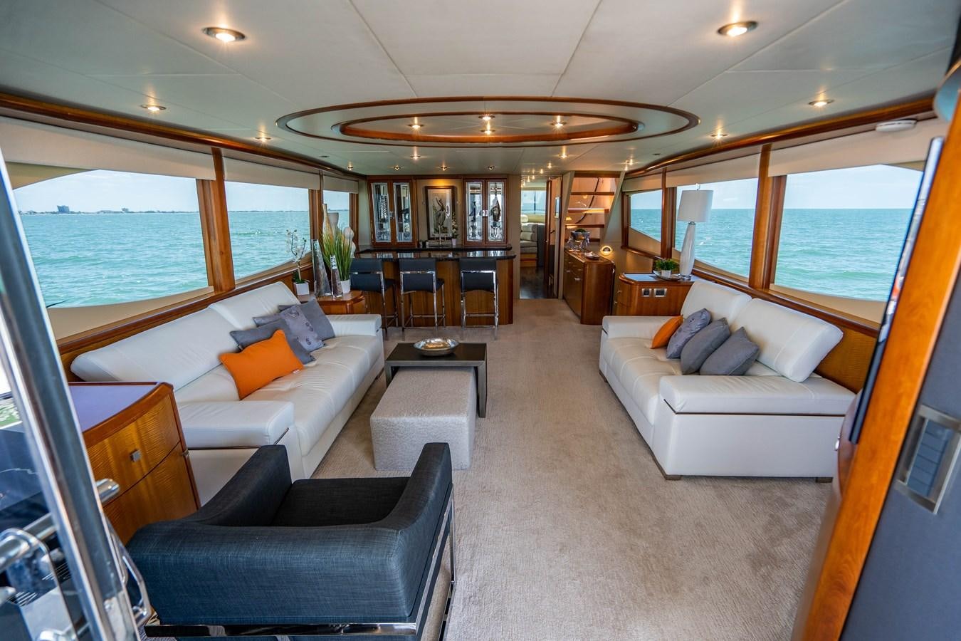 a living room with a couch and a table aboard VOYAGER Yacht for Sale