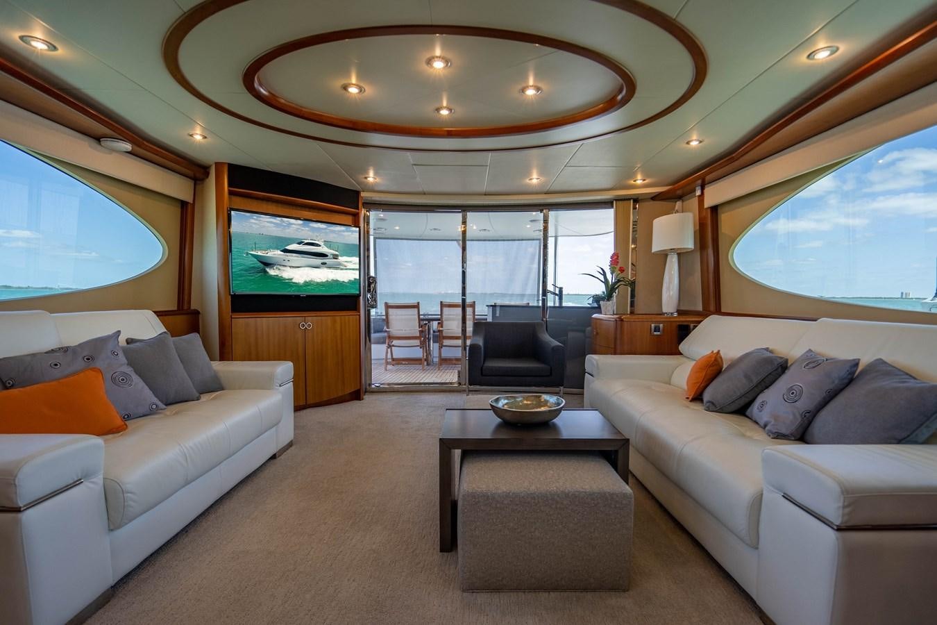 a living room with a large window aboard VOYAGER Yacht for Sale