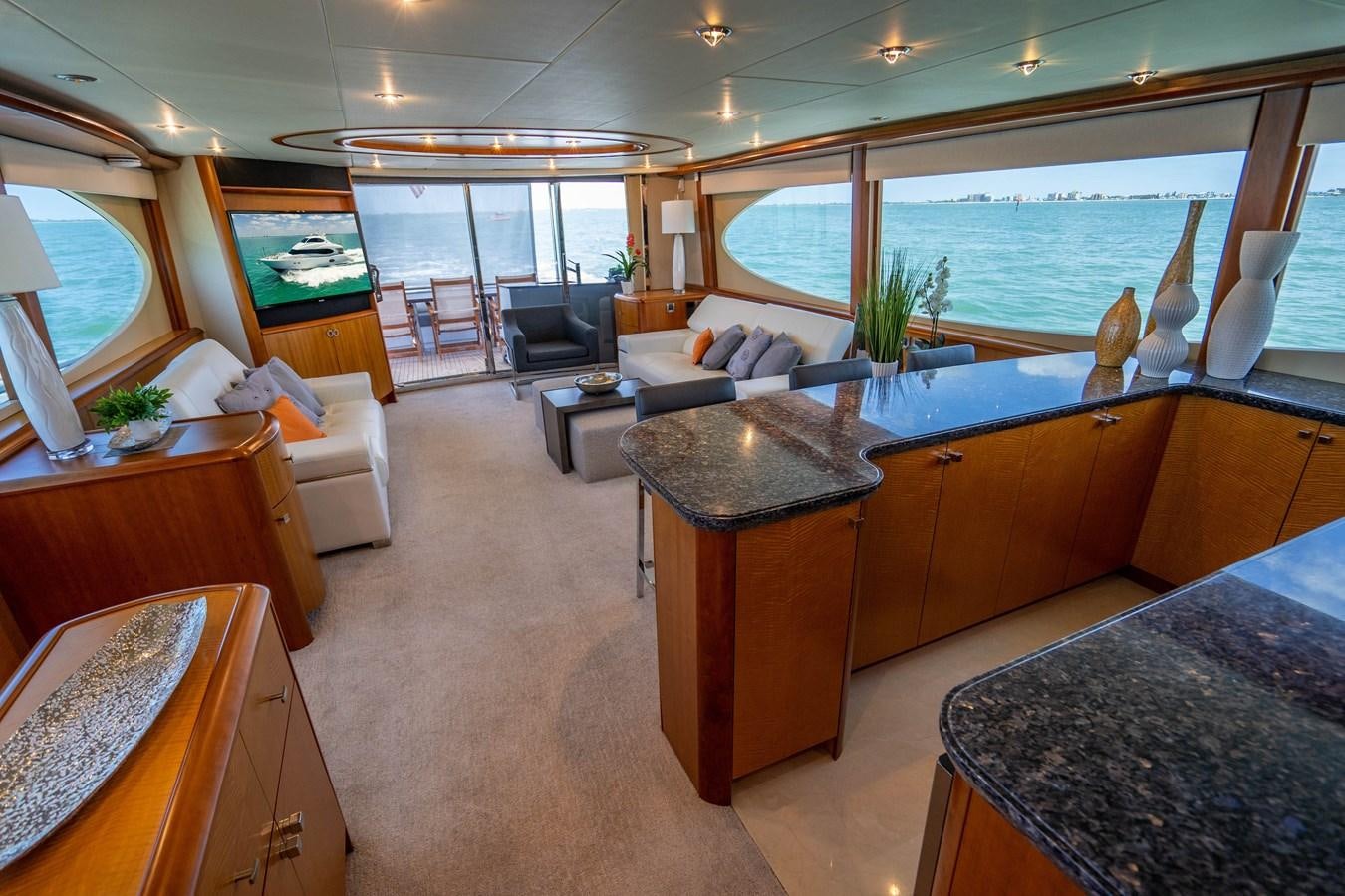 a large living room with a large window aboard VOYAGER Yacht for Sale