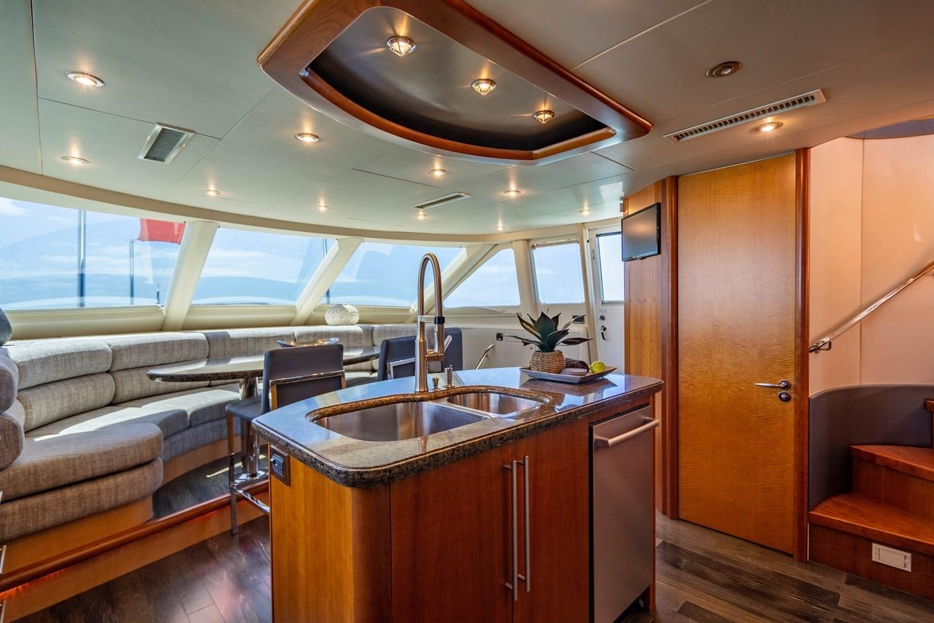 a kitchen with a sink and cabinets aboard VOYAGER Yacht for Sale