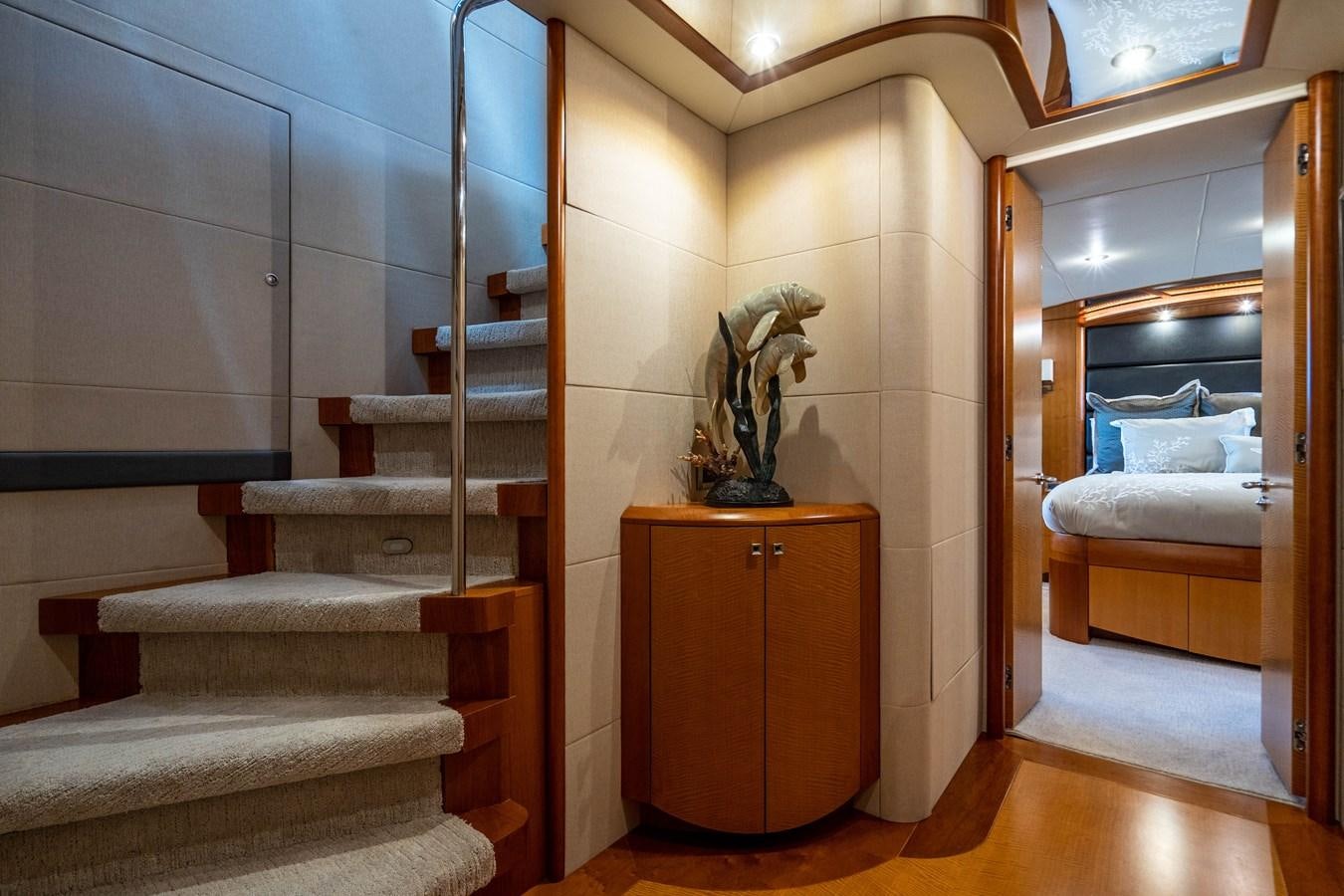 a room with a bed and a staircase aboard VOYAGER Yacht for Sale