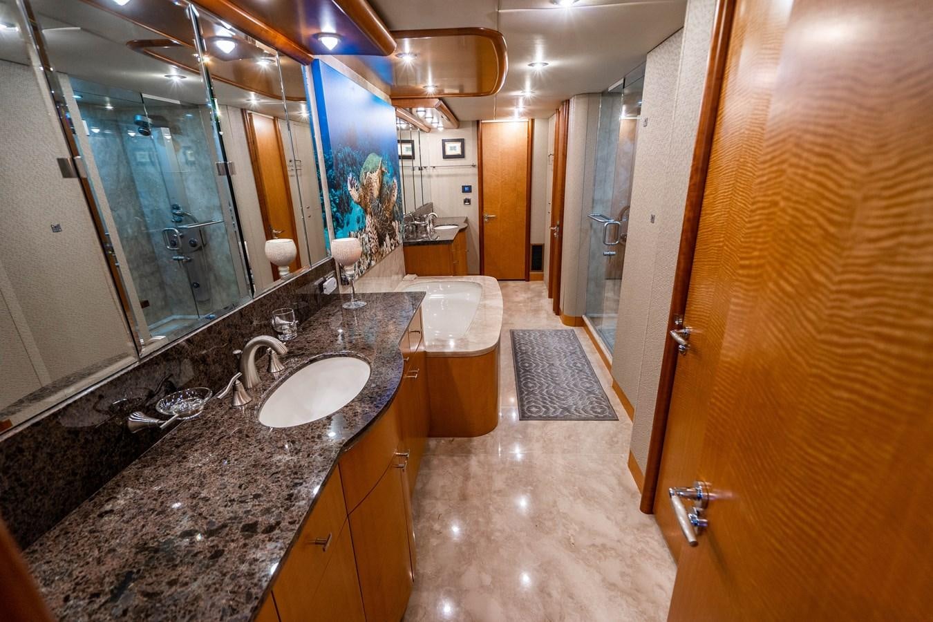 a bathroom with marble counter tops aboard VOYAGER Yacht for Sale