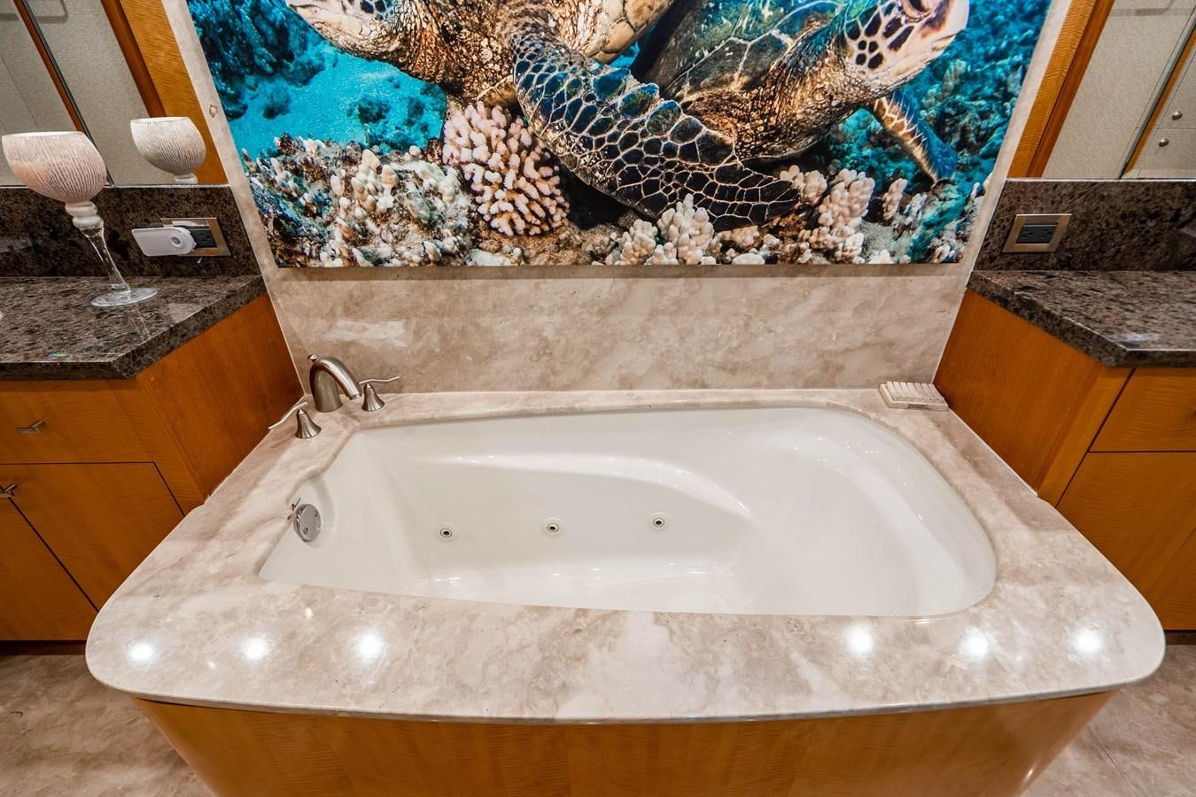 a bathtub in a bathroom aboard VOYAGER Yacht for Sale