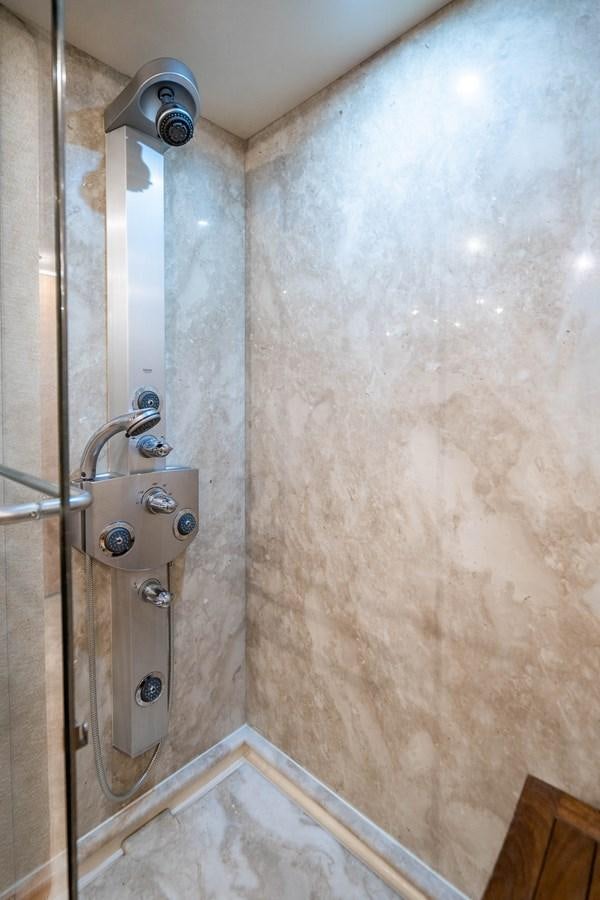 a shower with a glass door aboard VOYAGER Yacht for Sale
