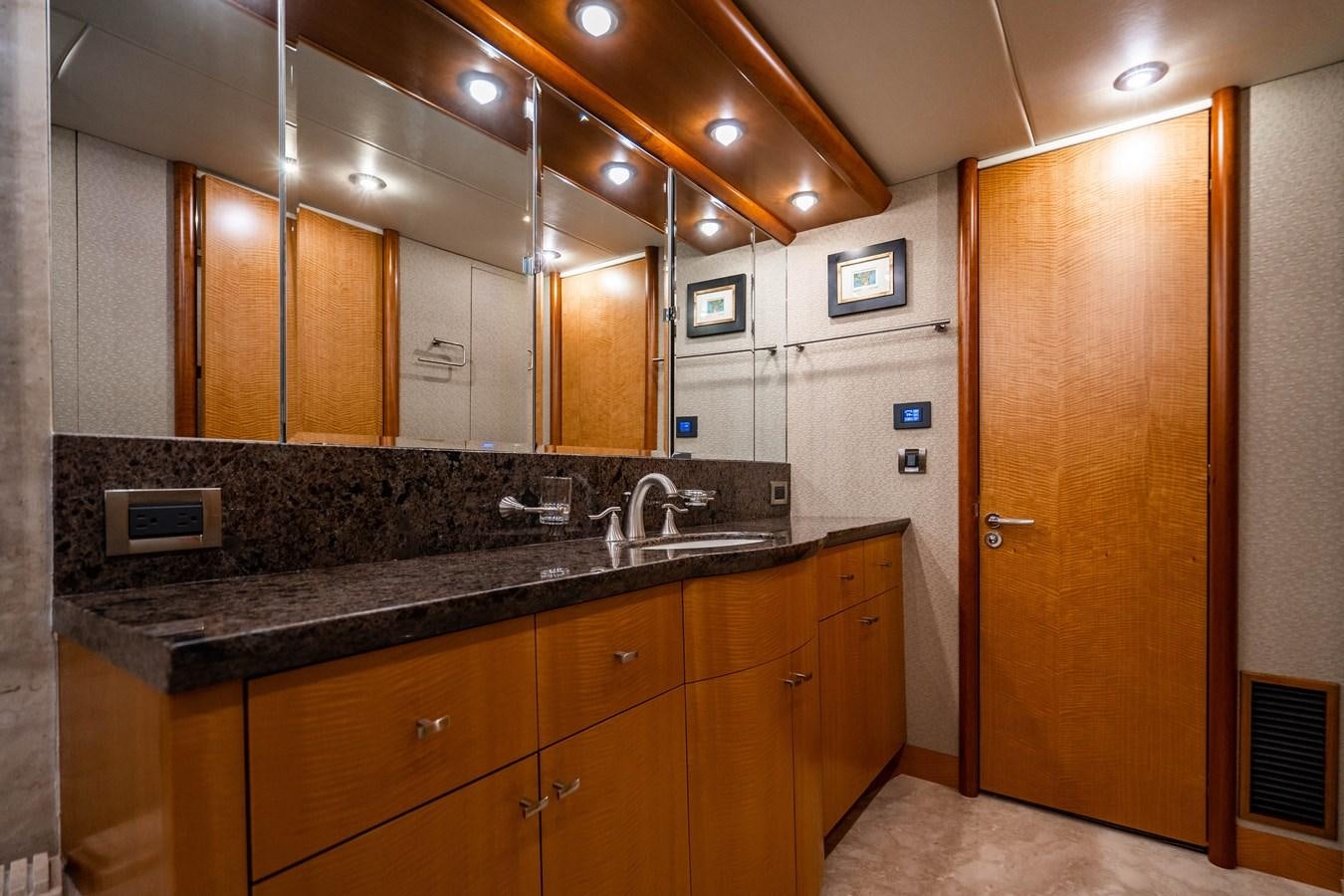 a kitchen with a marble counter top aboard VOYAGER Yacht for Sale