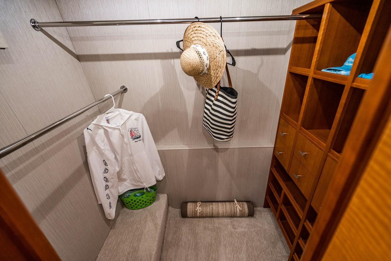 a room with a basket and a couple of baseballs from the ceiling aboard VOYAGER Yacht for Sale
