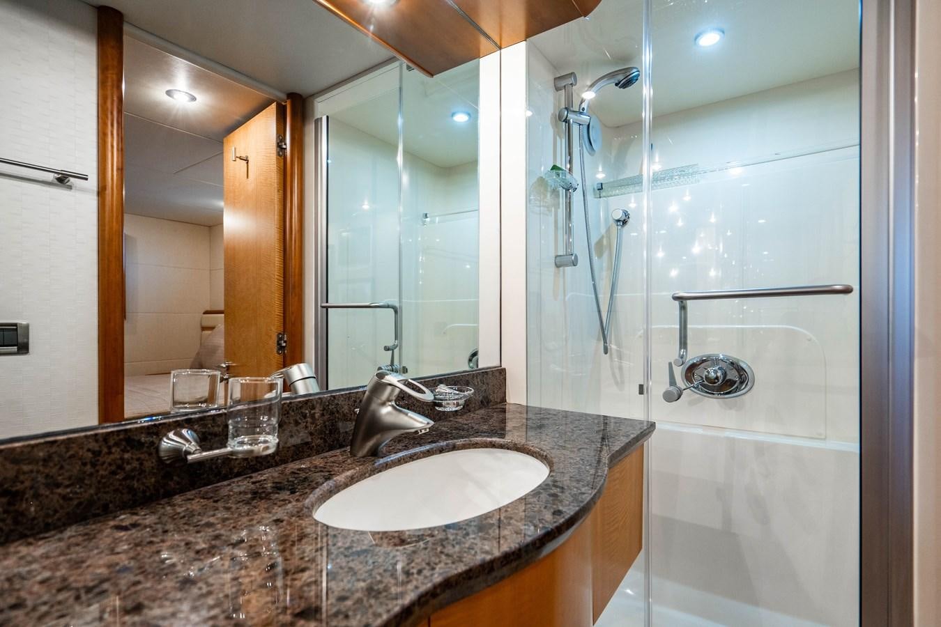 a bathroom with a marble countertop aboard VOYAGER Yacht for Sale
