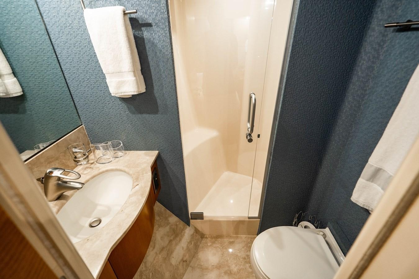 a bathroom with a sink and a toilet aboard VOYAGER Yacht for Sale