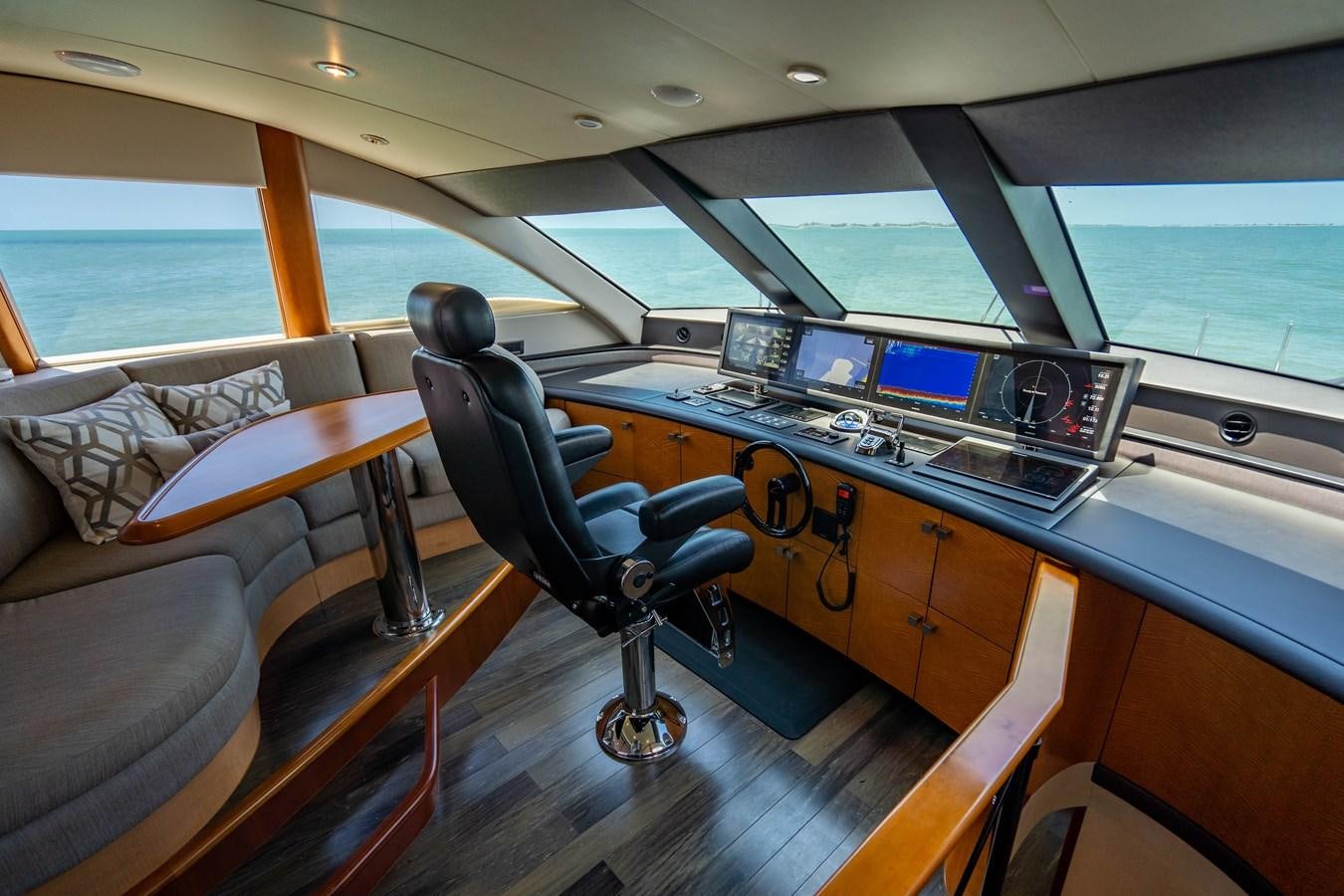 a person sitting in a chair in a boat aboard VOYAGER Yacht for Sale
