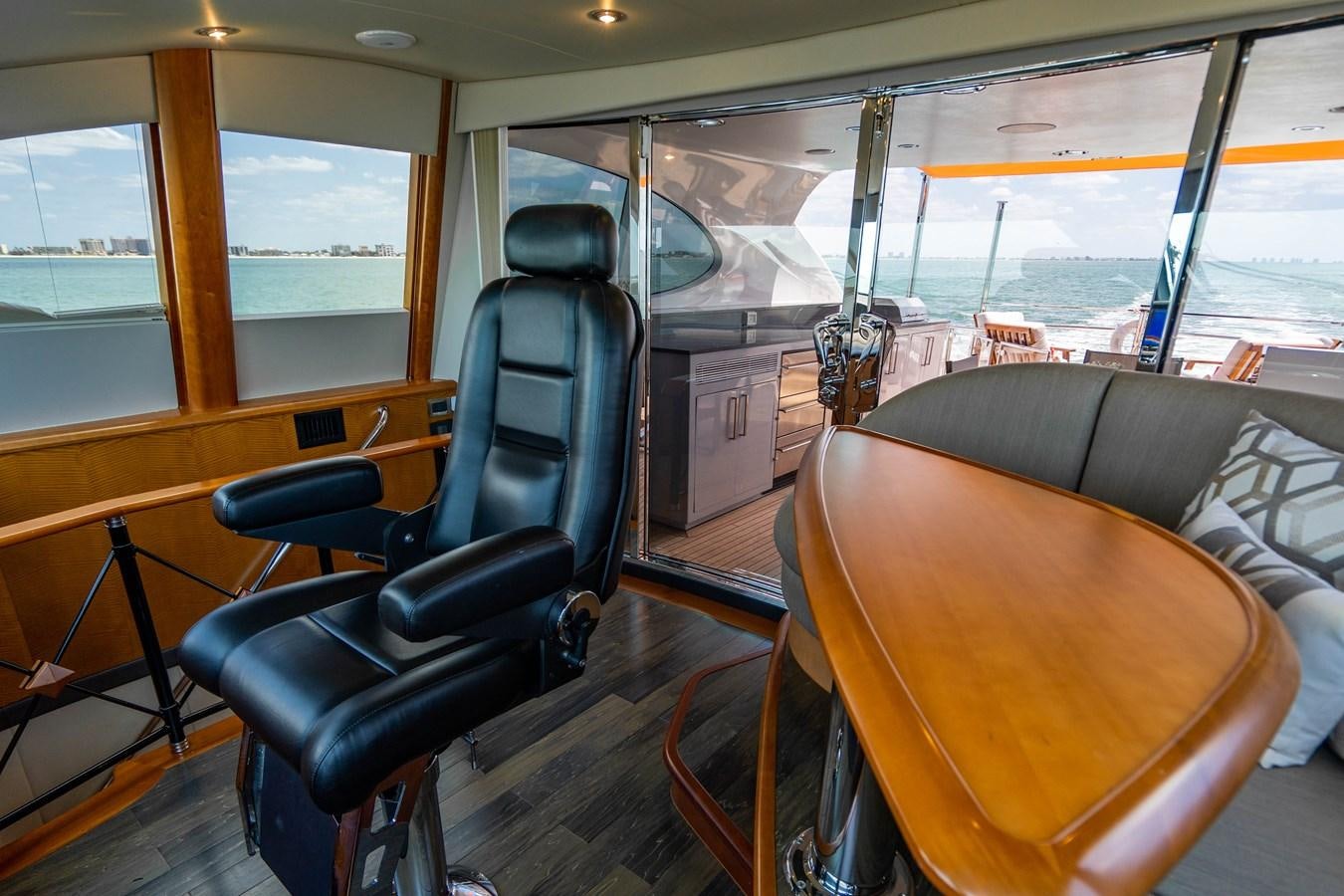 a bus with a seat and a desk aboard VOYAGER Yacht for Sale