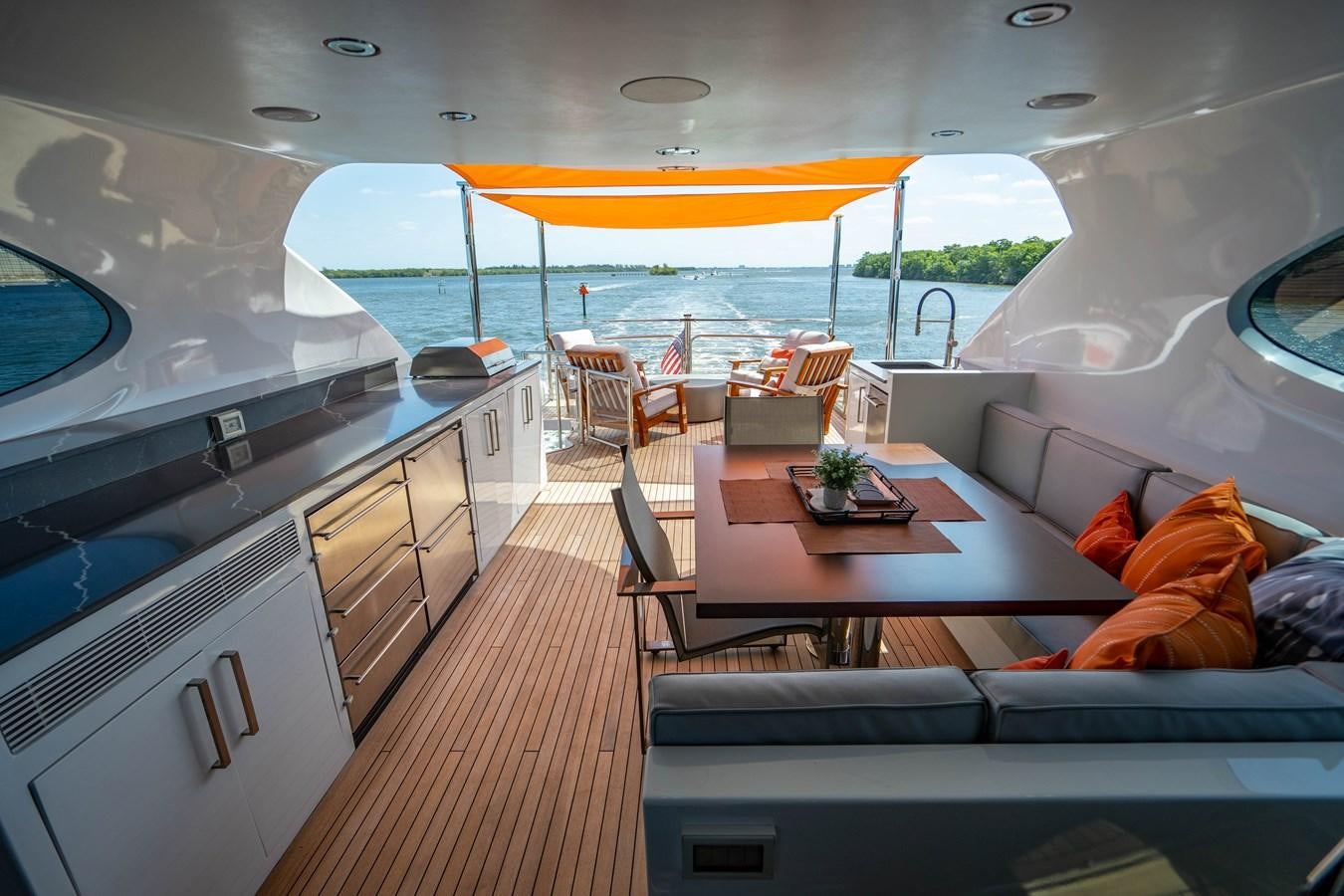a boat with a table and chairs aboard VOYAGER Yacht for Sale