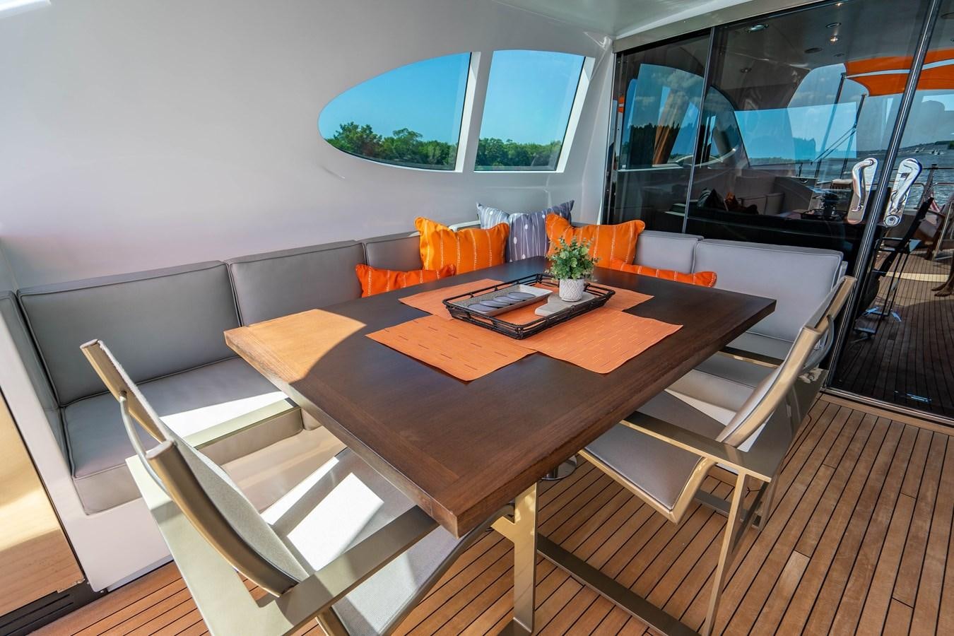 a table with chairs around it aboard VOYAGER Yacht for Sale