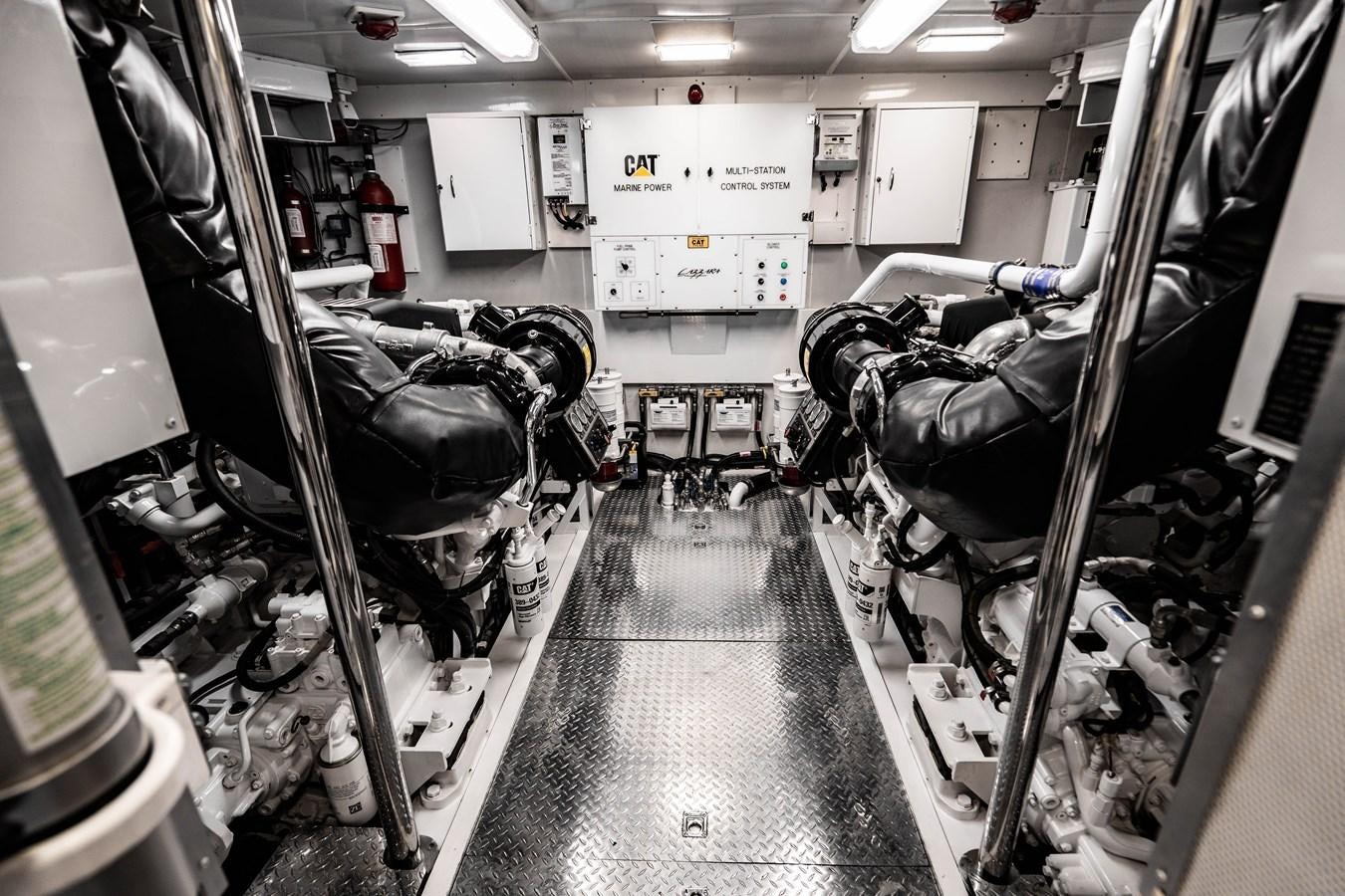 a room with a row of seats aboard VOYAGER Yacht for Sale