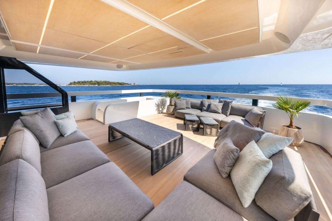 a living room with a large ocean aboard UILIA Yacht for Sale