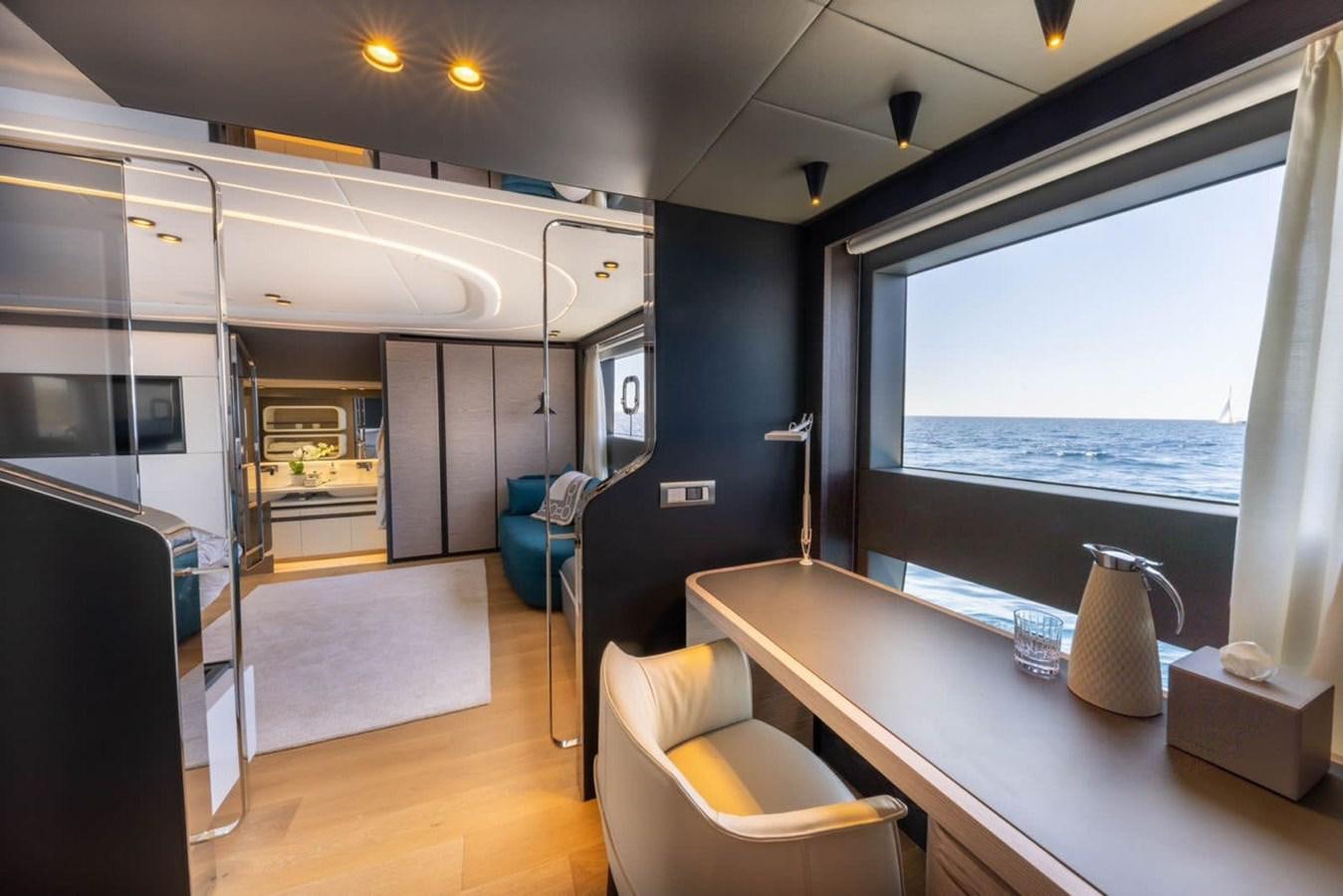 a room with a table and chairs aboard UILIA Yacht for Sale
