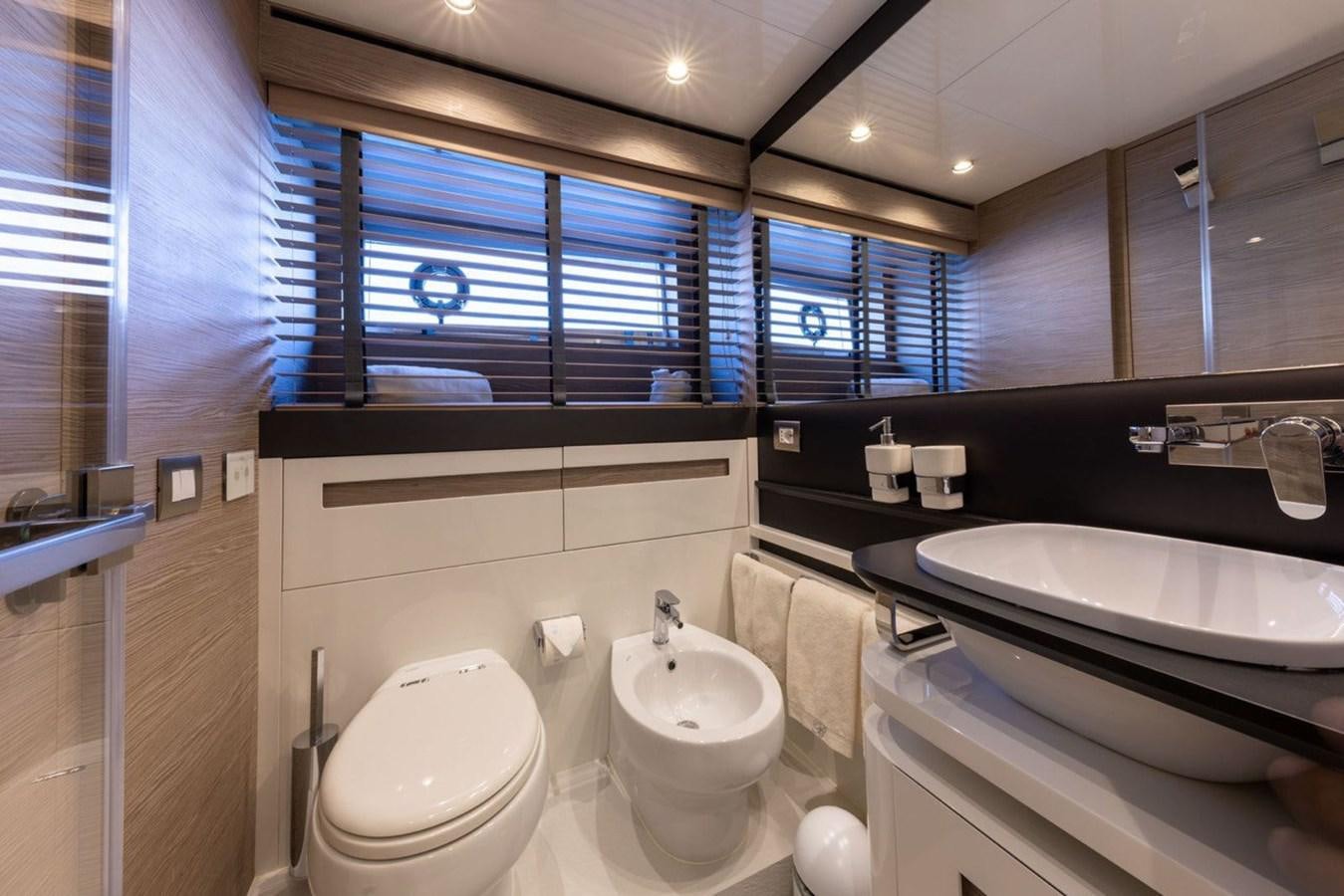 a bathroom with a sink toilet and a bathtub aboard UILIA Yacht for Sale