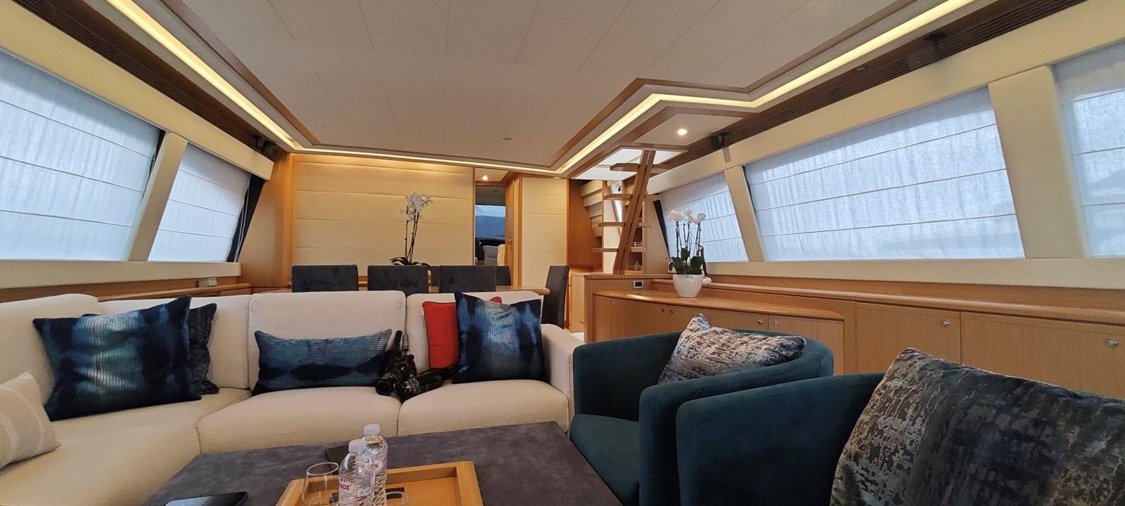 a living room with a couch and a coffee table aboard MAYBE NOT Yacht for Sale
