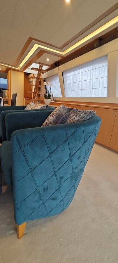a couch in a room aboard MAYBE NOT Yacht for Sale