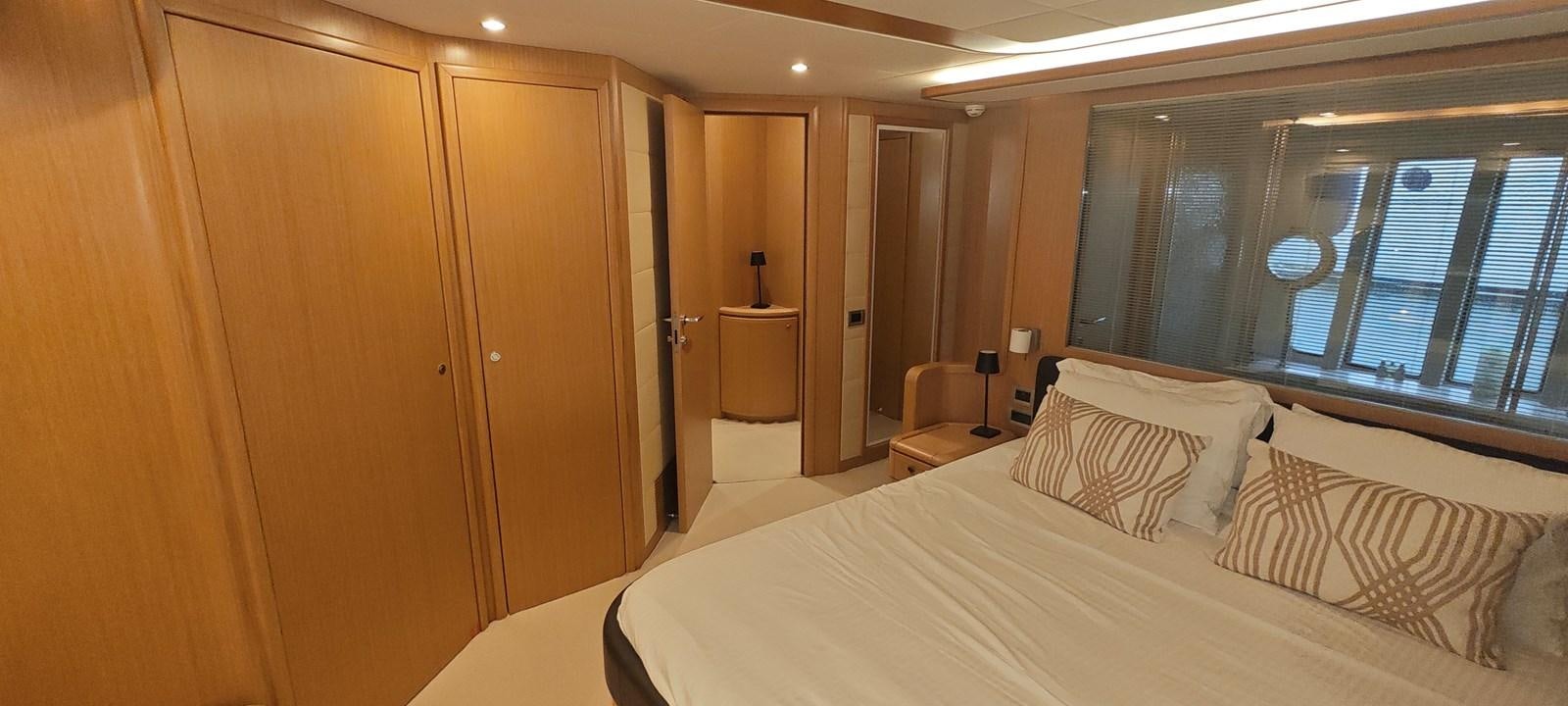 a bed in a room aboard MAYBE NOT Yacht for Sale