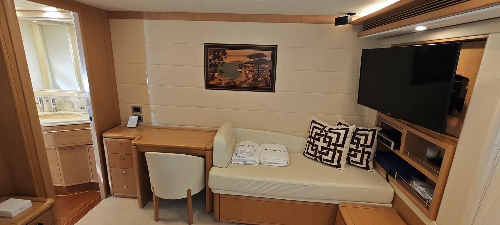 a hotel room with a bed and desk aboard MAYBE NOT Yacht for Sale