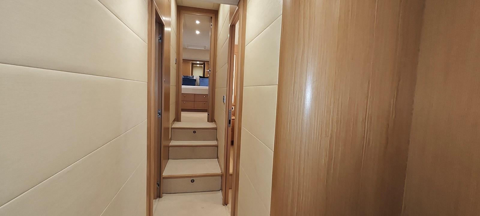 a hallway with a wood door and a wood door aboard MAYBE NOT Yacht for Sale