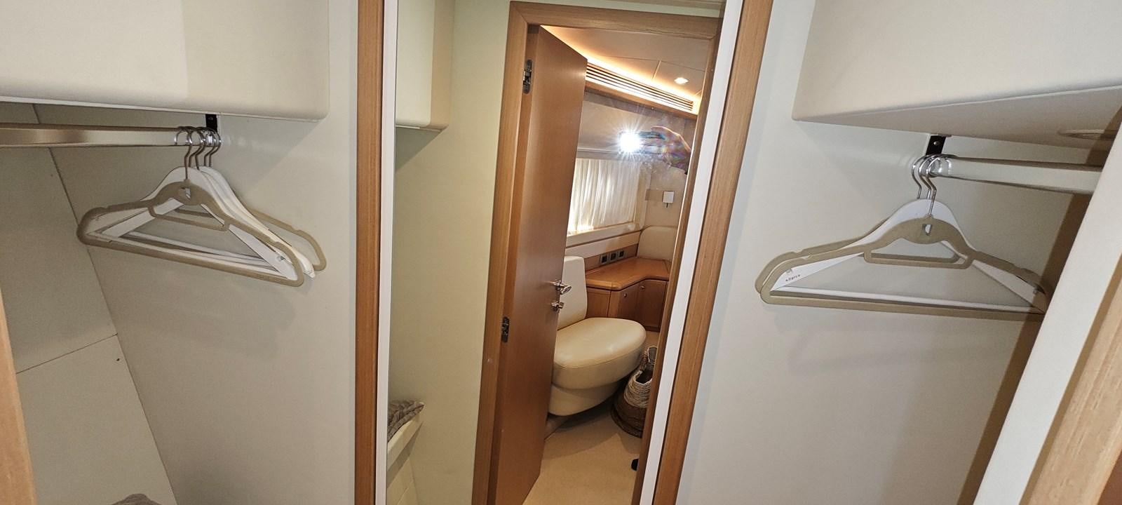 a bathroom with a sink and toilet aboard MAYBE NOT Yacht for Sale