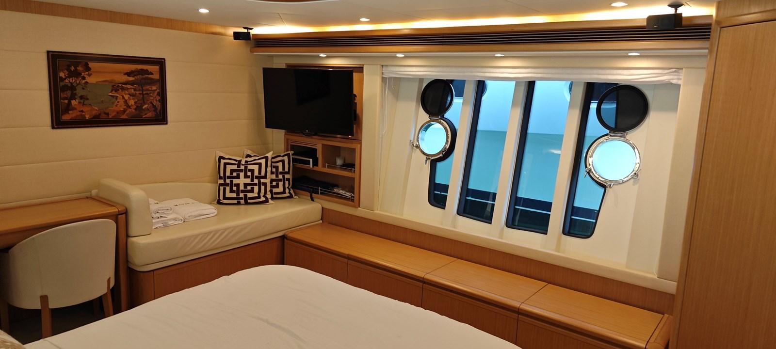 a room with a bed and a tv aboard MAYBE NOT Yacht for Sale