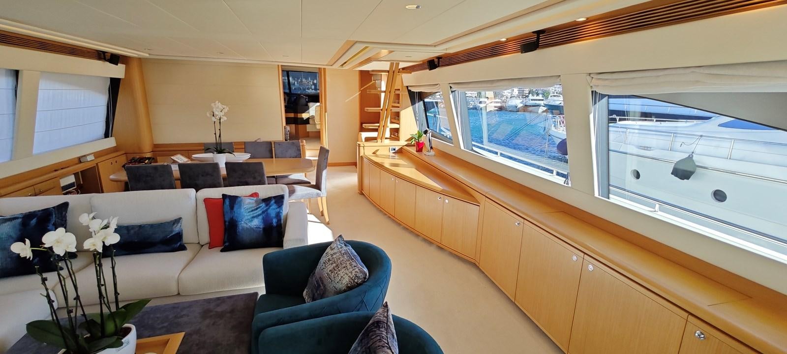 a living room with a large window aboard MAYBE NOT Yacht for Sale