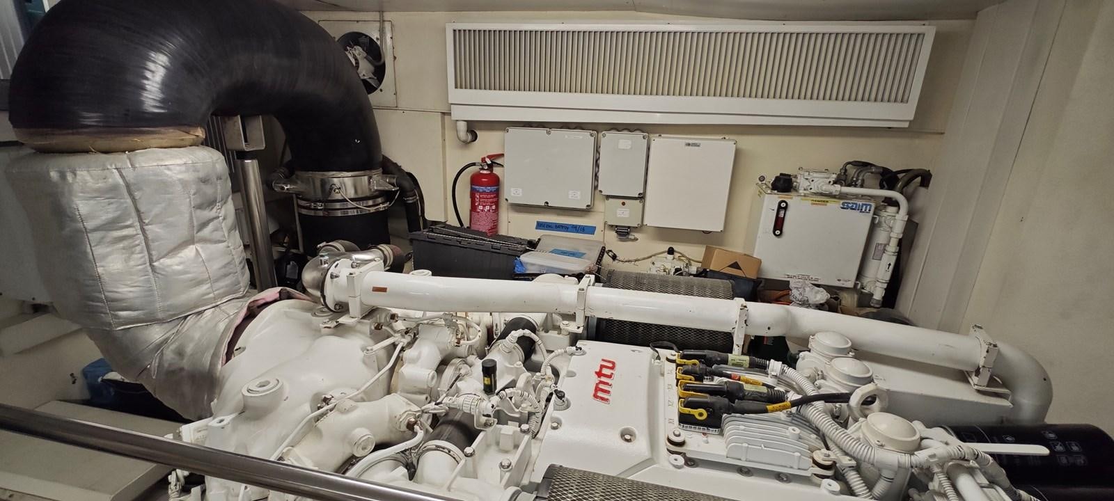 a person working on a machine aboard MAYBE NOT Yacht for Sale