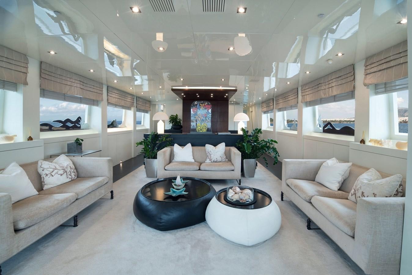 a living room with a large fireplace aboard XANAX Yacht for Sale