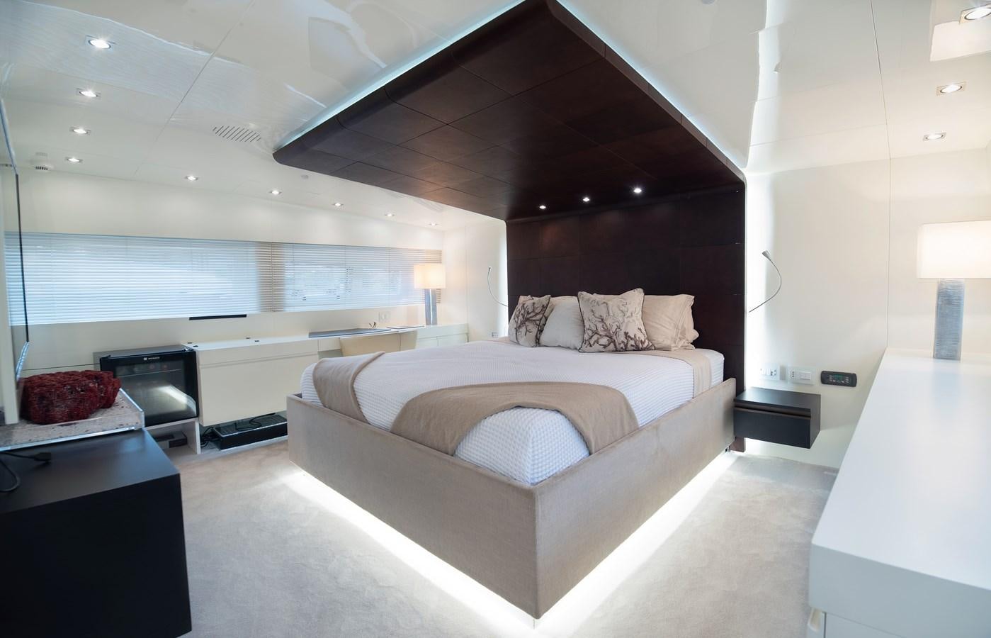a large bedroom with a large bed aboard XANAX Yacht for Sale