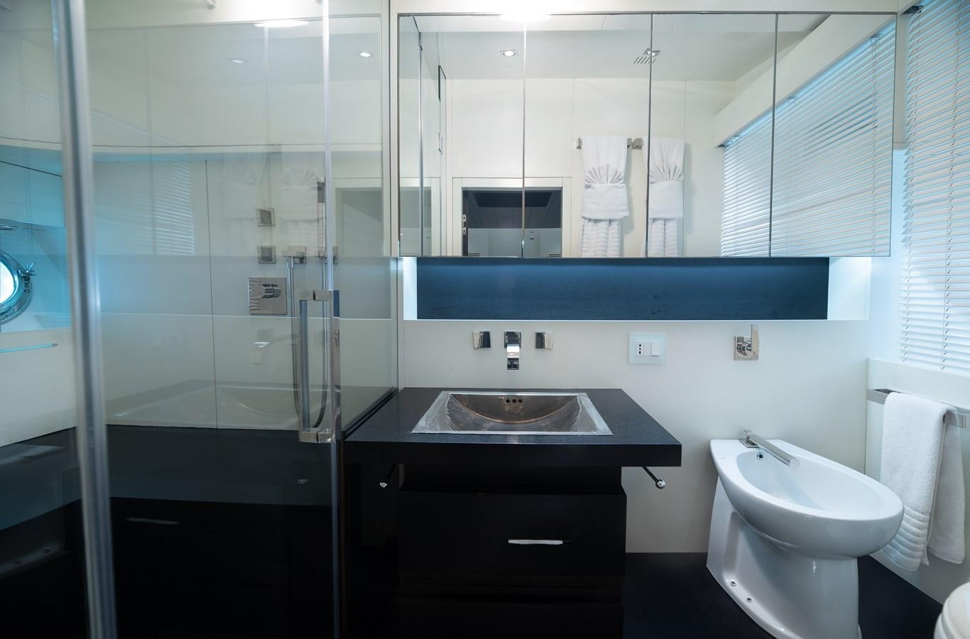 a bathroom with a sink and a mirror aboard XANAX Yacht for Sale