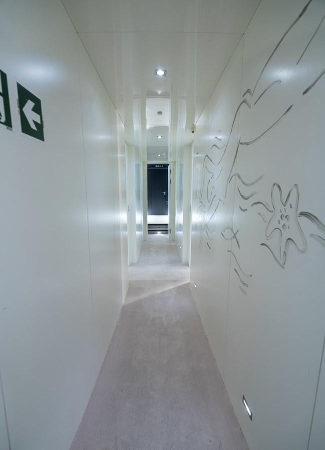 a hallway with white walls aboard XANAX Yacht for Sale