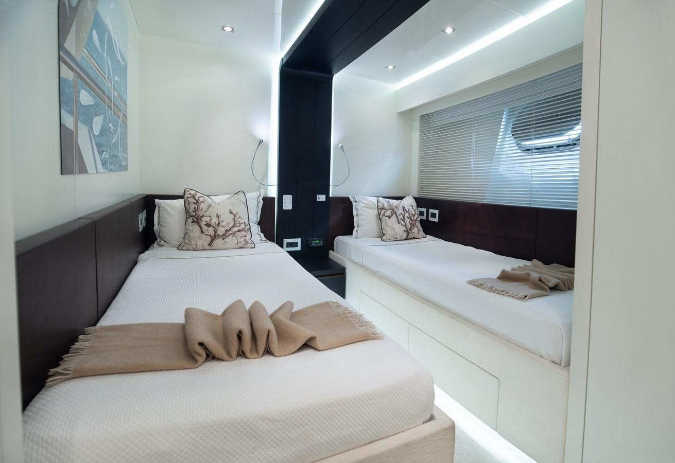 a room with two beds aboard XANAX Yacht for Sale