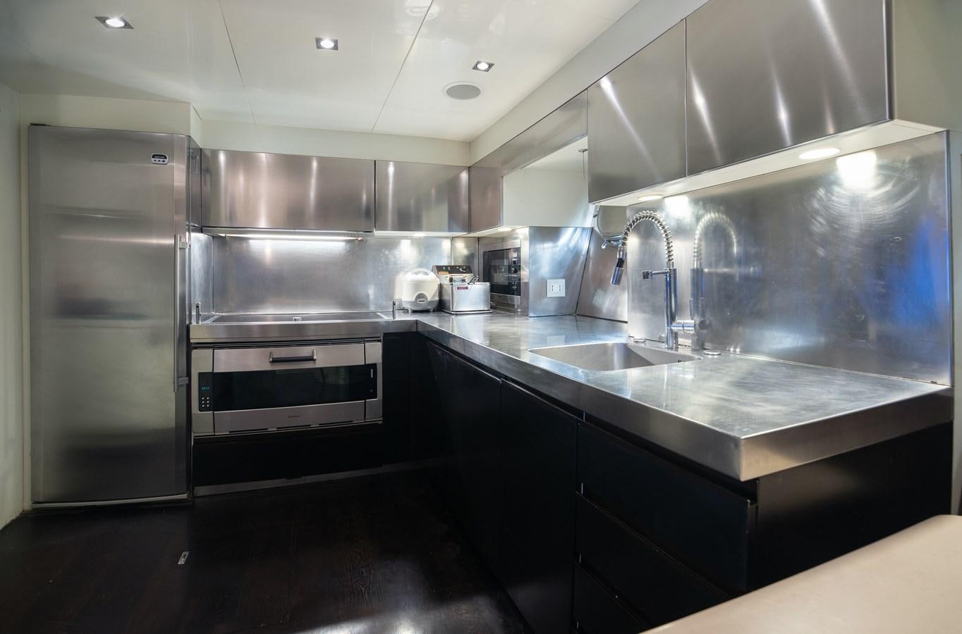 a kitchen with stainless steel appliances aboard XANAX Yacht for Sale