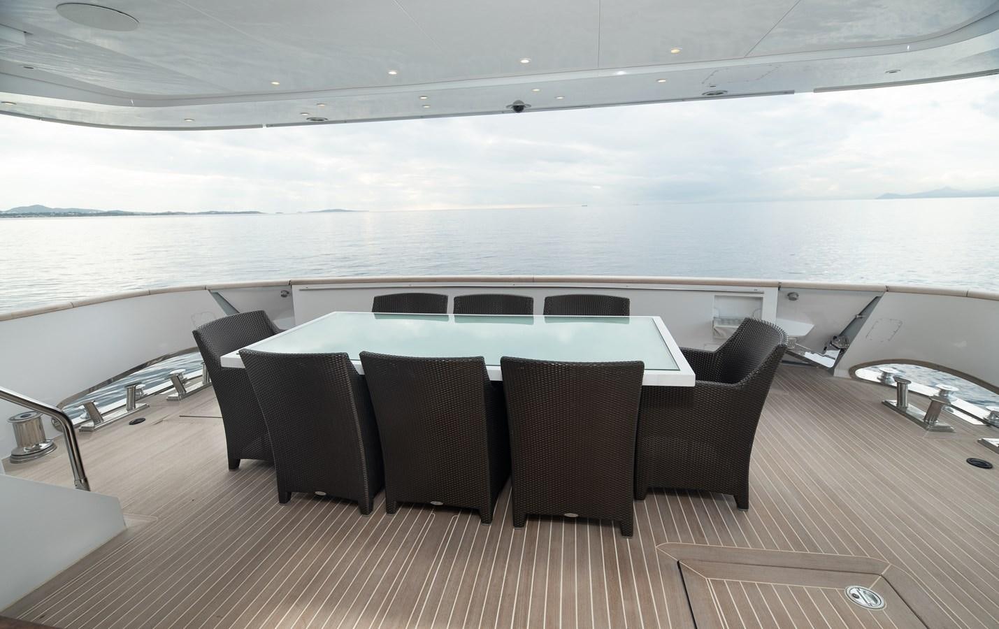 a room with a table and chairs aboard XANAX Yacht for Sale