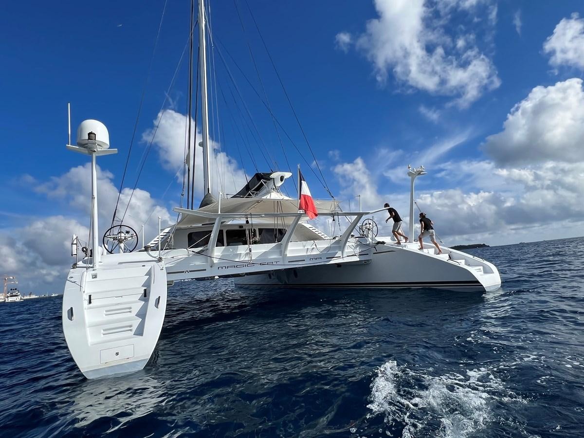 a boat on the water aboard MAGIC CAT Yacht for Sale