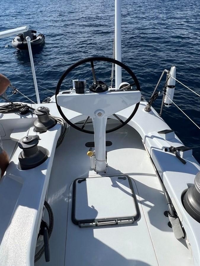 a boat with a steering wheel aboard MAGIC CAT Yacht for Sale