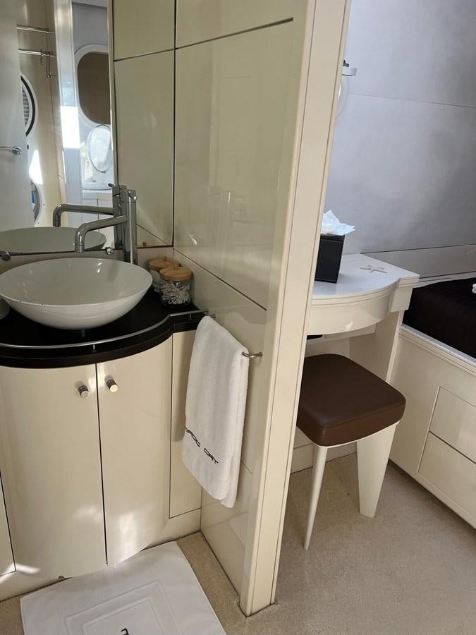 a bathroom with a sink and a mirror aboard MAGIC CAT Yacht for Sale