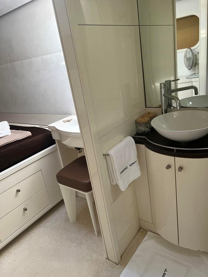 a bathroom with a sink and a toilet aboard MAGIC CAT Yacht for Sale