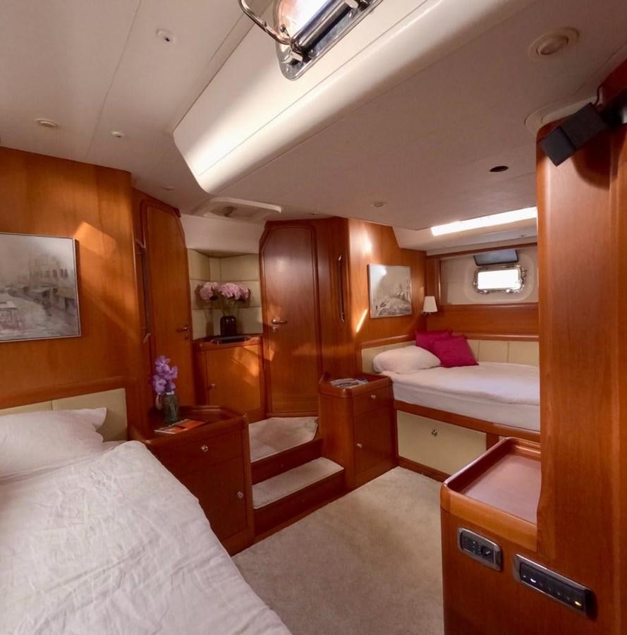 a room with a bed and a desk aboard DUNJA Yacht for Sale