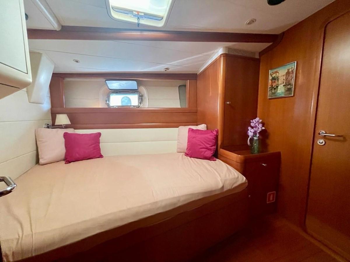 a bed with pink pillows aboard DUNJA Yacht for Sale