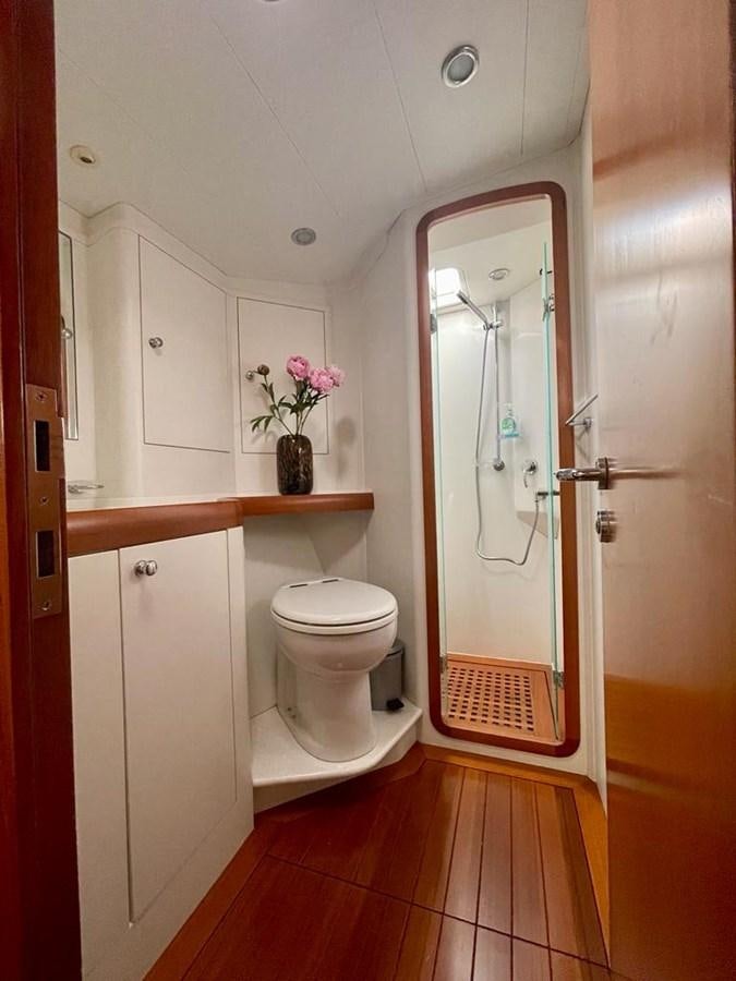a bathroom with a toilet and a sink aboard DUNJA Yacht for Sale