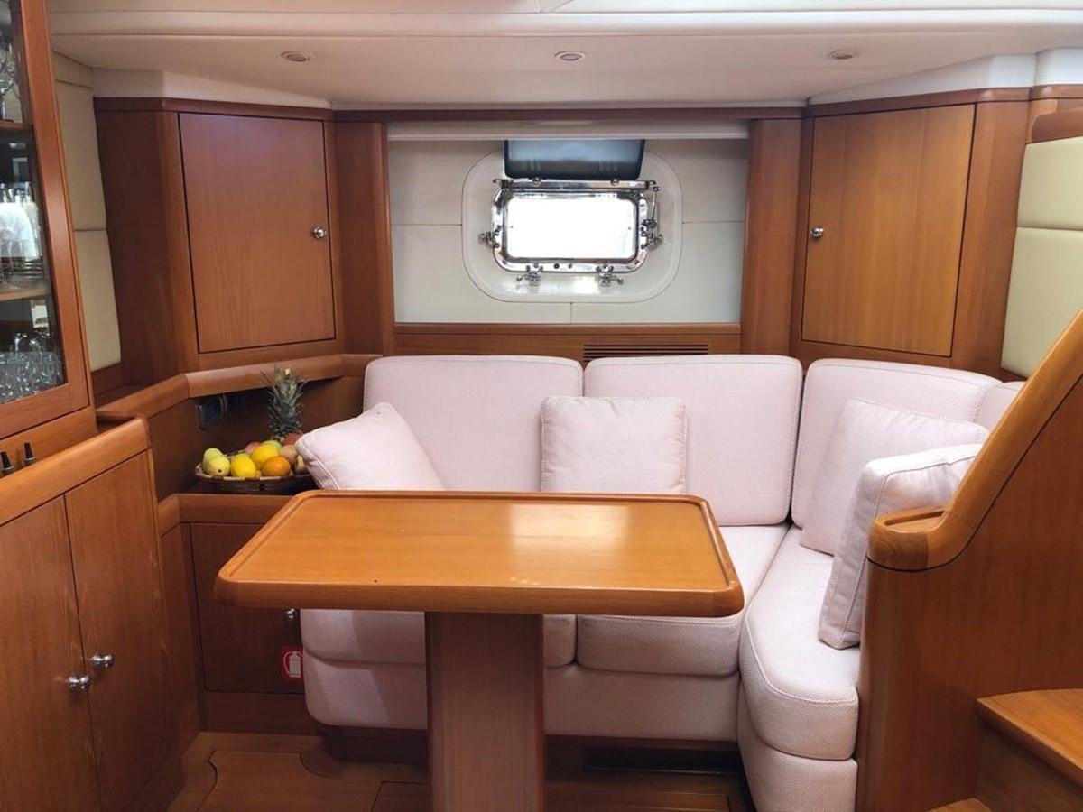 a room with a couch and a table aboard DUNJA Yacht for Sale