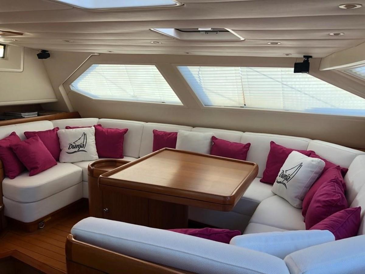 a living room with a couch and a coffee table aboard DUNJA Yacht for Sale