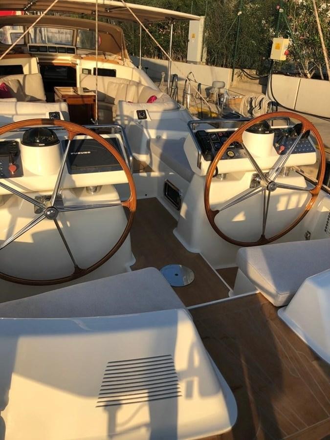 a group of cars parked outside aboard DUNJA Yacht for Sale