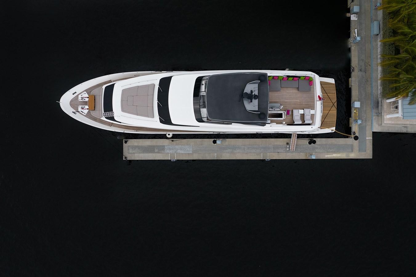 a white and black vehicle aboard RYEN Yacht for Sale
